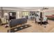 Open-concept living room with tile floors, modern furniture, and an eat-in kitchen at 7101 E Cholla St, Scottsdale, AZ 85254