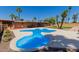 Beautiful pool, patio, and grassy area for leisure and entertaining in the backyard at 7101 E Cholla St, Scottsdale, AZ 85254