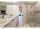 Modern bathroom with double sinks, marble countertops, tiled shower, and access to the rest of the house at 7117 E Rancho Vista Dr # 6007, Scottsdale, AZ 85251