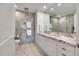Elegant bathroom with dual sinks, marble countertops, and stylish gray tiled walls and flooring at 7117 E Rancho Vista Dr # 6007, Scottsdale, AZ 85251