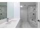 Bright bathroom featuring marble countertops, floors, tiled walls, and a shower and tub combo at 7117 E Rancho Vista Dr # 6007, Scottsdale, AZ 85251