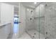 Modern tiled bathroom with a glass enclosed shower featuring a rainfall shower head and bench at 7117 E Rancho Vista Dr # 6007, Scottsdale, AZ 85251