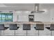 Elegant kitchen island with marble countertops, modern fixtures, and stainless steel appliances at 7117 E Rancho Vista Dr # 6007, Scottsdale, AZ 85251