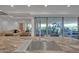 Gourmet kitchen with stainless steel sink, marble countertops, and exterior views into living room at 7117 E Rancho Vista Dr # 6007, Scottsdale, AZ 85251