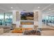 Cozy living room boasts sleek fireplace, large TV, and comfortable seating area for entertaining at 7117 E Rancho Vista Dr # 6007, Scottsdale, AZ 85251
