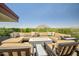 Outdoor patio with comfy seating and fire feature offering panoramic views of natural scenery at 7117 E Rancho Vista Dr # 6007, Scottsdale, AZ 85251