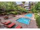 Relaxing pool and hot tub area with lounge chairs, tables, and umbrellas for outdoor leisure at 7117 E Rancho Vista Dr # 6007, Scottsdale, AZ 85251