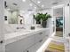 Bright bathroom with double vanity, storage, and statement mirrors at 7167 E Rancho Vista Dr # 3002, Scottsdale, AZ 85251