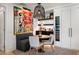 Stylish dining area with modern lighting, colorful art, and a built-in wine refrigerator at 7167 E Rancho Vista Dr # 3002, Scottsdale, AZ 85251