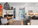 Open refrigerator next to the wine refrigerator in this bright and modern kitchen at 7167 E Rancho Vista Dr # 3002, Scottsdale, AZ 85251