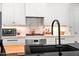 Clean white kitchen with marble backsplash, stainless steel appliances, and modern fixtures at 7167 E Rancho Vista Dr # 3002, Scottsdale, AZ 85251