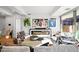 Bright living room with stylish decor, a modern fireplace, and views of lush greenery outside at 7167 E Rancho Vista Dr # 3002, Scottsdale, AZ 85251
