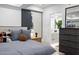 The main bedroom features a king bed, en-suite bathroom, and modern artwork at 7167 E Rancho Vista Dr # 3002, Scottsdale, AZ 85251