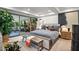 This main bedroom features a bench, soft colors, a plush rug, and access to the outdoor living space at 7167 E Rancho Vista Dr # 3002, Scottsdale, AZ 85251