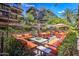 Inviting outdoor patio with comfortable seating, lush greenery, and a misting system for added comfort at 7167 E Rancho Vista Dr # 3002, Scottsdale, AZ 85251