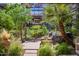 Serene patio featuring a hammock, fire pit, and lush landscaping for ultimate relaxation at 7167 E Rancho Vista Dr # 3002, Scottsdale, AZ 85251