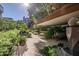 Expansive patio features comfortable seating, water feature, lush landscaping, and serene outdoor living at 7167 E Rancho Vista Dr # 3002, Scottsdale, AZ 85251