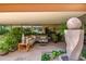 Inviting patio features comfortable seating, water feature, lush greenery, and an outdoor TV for entertainment at 7167 E Rancho Vista Dr # 3002, Scottsdale, AZ 85251