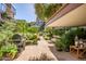 Expansive patio showcases lush landscaping, grill area, comfortable seating for outdoor relaxation and entertaining at 7167 E Rancho Vista Dr # 3002, Scottsdale, AZ 85251