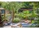 Outdoor seating and hammock amongst lush mature landscaping at 7167 E Rancho Vista Dr # 3002, Scottsdale, AZ 85251