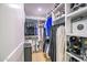 Walk-in closet with custom shelving for shoes, clothes and accessories at 7167 E Rancho Vista Dr # 3002, Scottsdale, AZ 85251