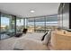 Sunlit bedroom features a seating area and floor-to-ceiling windows showcasing city views at 7180 E Kierland Blvd # 916, Scottsdale, AZ 85254
