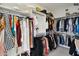 Spacious walk-in closet with ample storage space, shelving, and hanging racks at 7180 E Kierland Blvd # 916, Scottsdale, AZ 85254