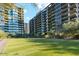 Lush green courtyard featuring modern apartment buildings, highlighting a vibrant community at 7180 E Kierland Blvd # 916, Scottsdale, AZ 85254