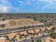 Aerial view showing neighborhood, landscape and mountain view in the distance at 7551 W Pasadena Ave, Glendale, AZ 85303