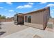 Low-maintenance backyard featuring a covered patio and brick pavers at 7551 W Pasadena Ave, Glendale, AZ 85303