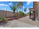 Landscaped backyard with trees, shrubbery, and brick-paved patio space at 7551 W Pasadena Ave, Glendale, AZ 85303