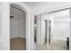 Bedroom with attached bathroom and mirrored closet doors at 7551 W Pasadena Ave, Glendale, AZ 85303
