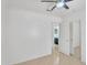 Spacious bedroom featuring a ceiling fan and closet, leading to a bathroom at 7551 W Pasadena Ave, Glendale, AZ 85303