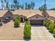 Charming single-story home with a well-manicured lawn, desert landscaping, and a two-car garage at 7551 W Pasadena Ave, Glendale, AZ 85303