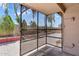 Enclosed patio area providing shade and views of the landscaped backyard at 7551 W Pasadena Ave, Glendale, AZ 85303
