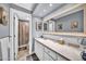 Bright bathroom with a modern sink, mirror and a view into the shower room at 7625 E Camelback Rd # B138, Scottsdale, AZ 85251