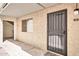 Apartment entryway showcasing secure door with window and exterior access to stairs at 7625 E Camelback Rd # B138, Scottsdale, AZ 85251