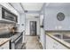 Kitchen view showcasing stainless steel appliances, granite countertops and ample cabinet space at 7625 E Camelback Rd # B138, Scottsdale, AZ 85251