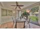 Covered outdoor patio featuring a dining table, fan, and peaceful community views at 7625 E Camelback Rd # B138, Scottsdale, AZ 85251