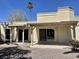 Back of house with sliding doors and a covered patio area at 8947 N 84Th Way, Scottsdale, AZ 85258