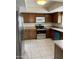 Kitchen featuring stainless steel appliances and ceramic tile flooring at 8947 N 84Th Way, Scottsdale, AZ 85258