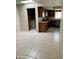 Spacious kitchen featuring ceramic tile flooring and adjoining laundry room at 8947 N 84Th Way, Scottsdale, AZ 85258