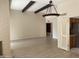 Bright living room with wood floors, beamed ceiling and pendant light at 8947 N 84Th Way, Scottsdale, AZ 85258