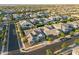 Aerial view of a neighborhood showcasing houses, landscaped yards, and community streets at 10322 E Topaz Ave, Mesa, AZ 85212
