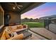 Spacious backyard with putting green, cozy seating and outdoor dining area at 10322 E Topaz Ave, Mesa, AZ 85212