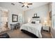 Bedroom showcasing a desk, bed with white linens, and a ceiling fan at 10322 E Topaz Ave, Mesa, AZ 85212
