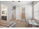 Bedroom showcasing neutral walls, a window, and a decorative ladder shelf at 10322 E Topaz Ave, Mesa, AZ 85212