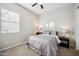 Bedroom showcasing a ceiling fan, window with blinds, and neutral decor at 10322 E Topaz Ave, Mesa, AZ 85212