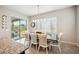 Bright dining area with sliding door access to the outdoor space, perfect for entertaining at 10322 E Topaz Ave, Mesa, AZ 85212