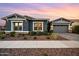Charming home with a well-maintained front yard featuring desert landscaping and a two-car garage at 10322 E Topaz Ave, Mesa, AZ 85212